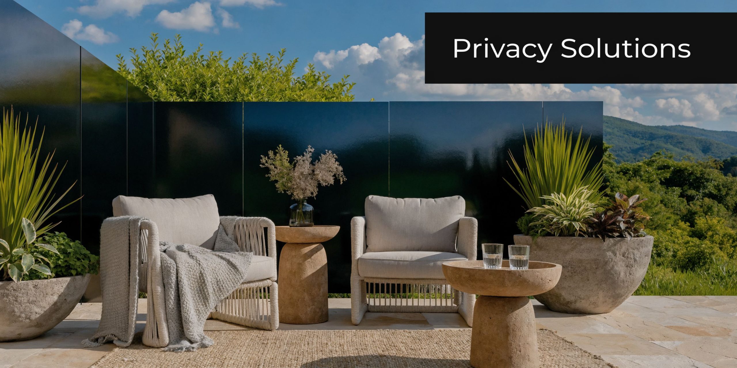 A luxurious patio outdoor seating area featuring beige armchairs, stone tables, and modern privacy screens.